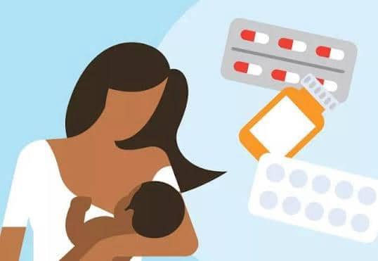 Illustration of a breastfeeding mother next to pills and medication packaging